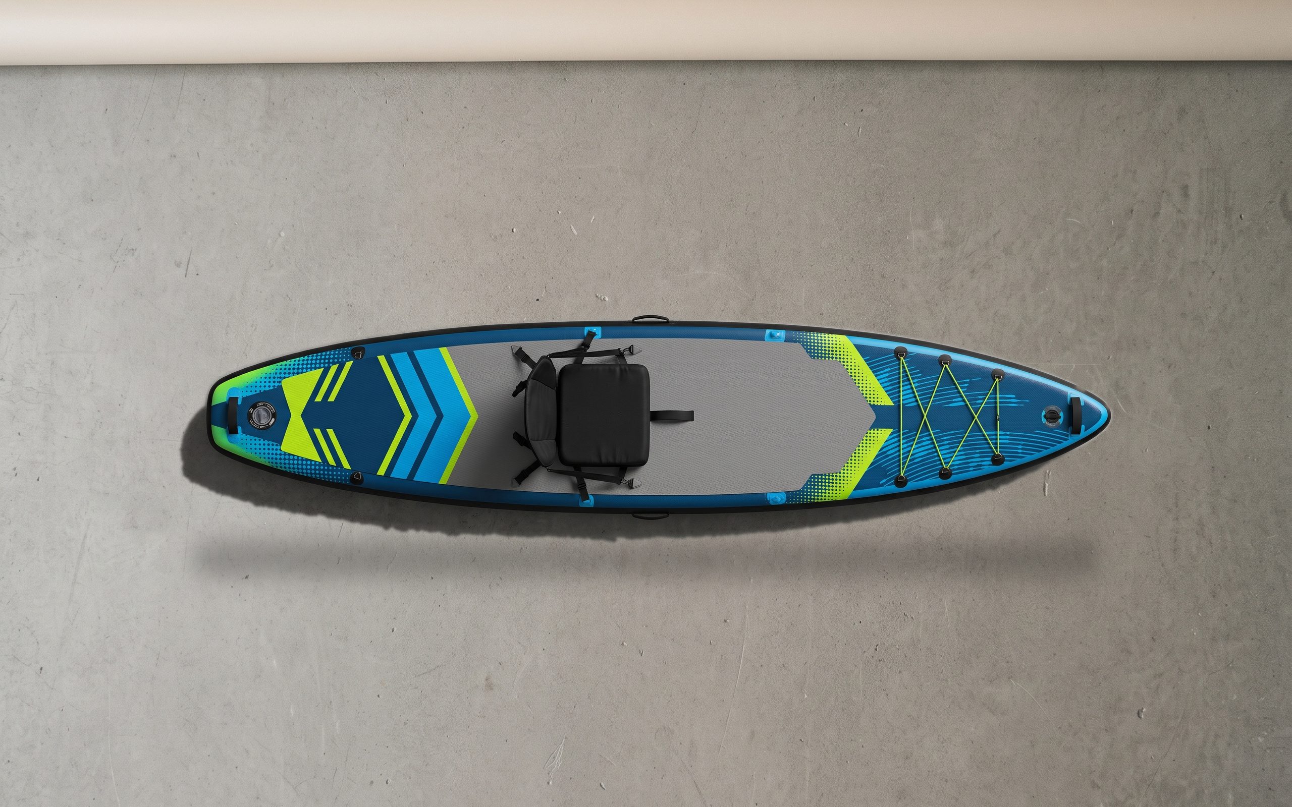 Fitness inflatable paddle board, deck side up on a plain floor.