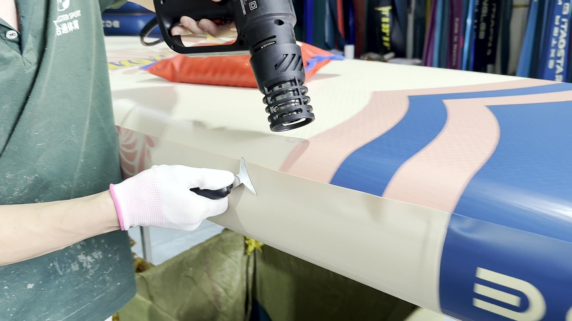 Heat gun and knife finishing an outer rail seam.