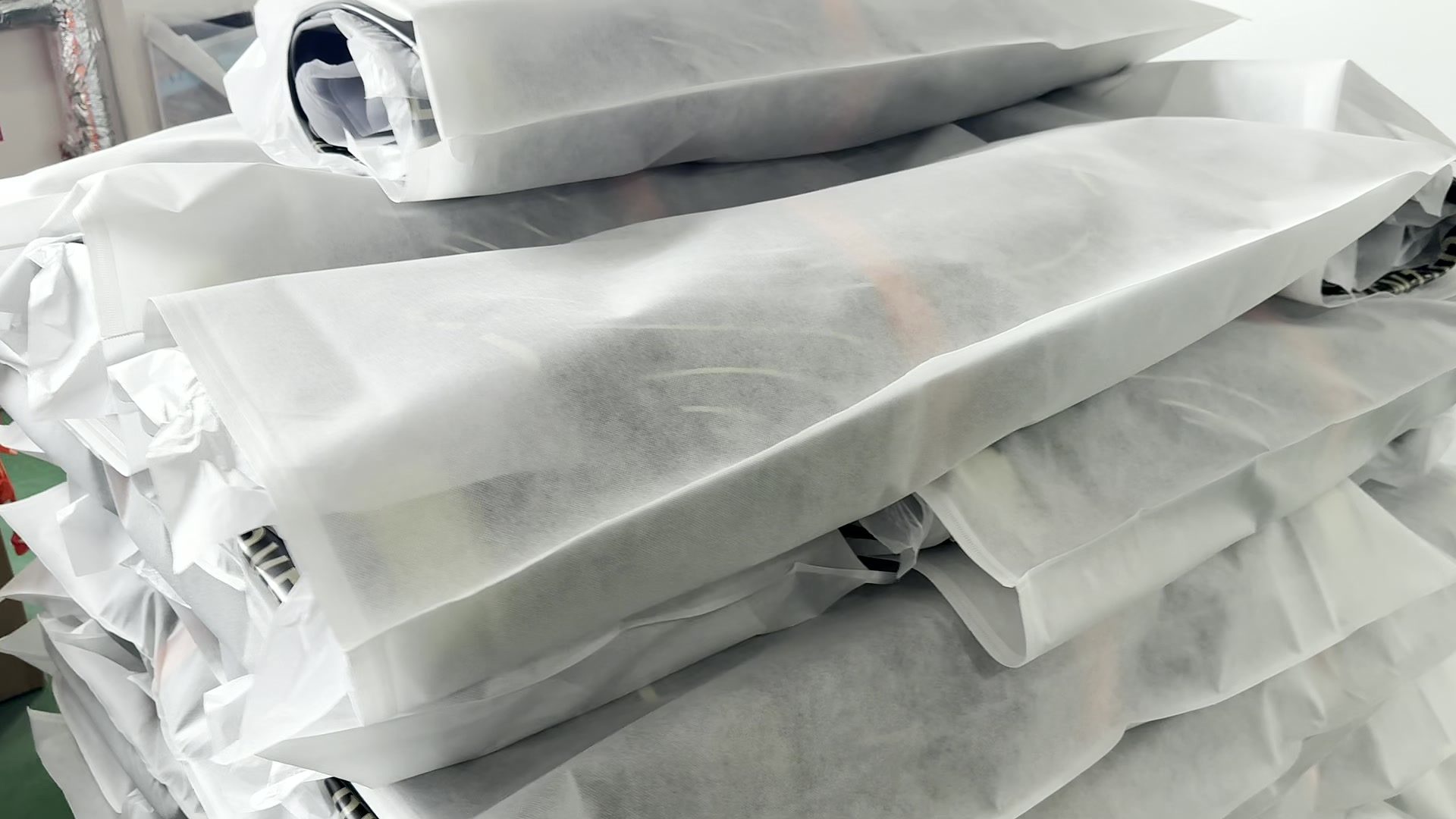 Wrapped boards stacked for packing.