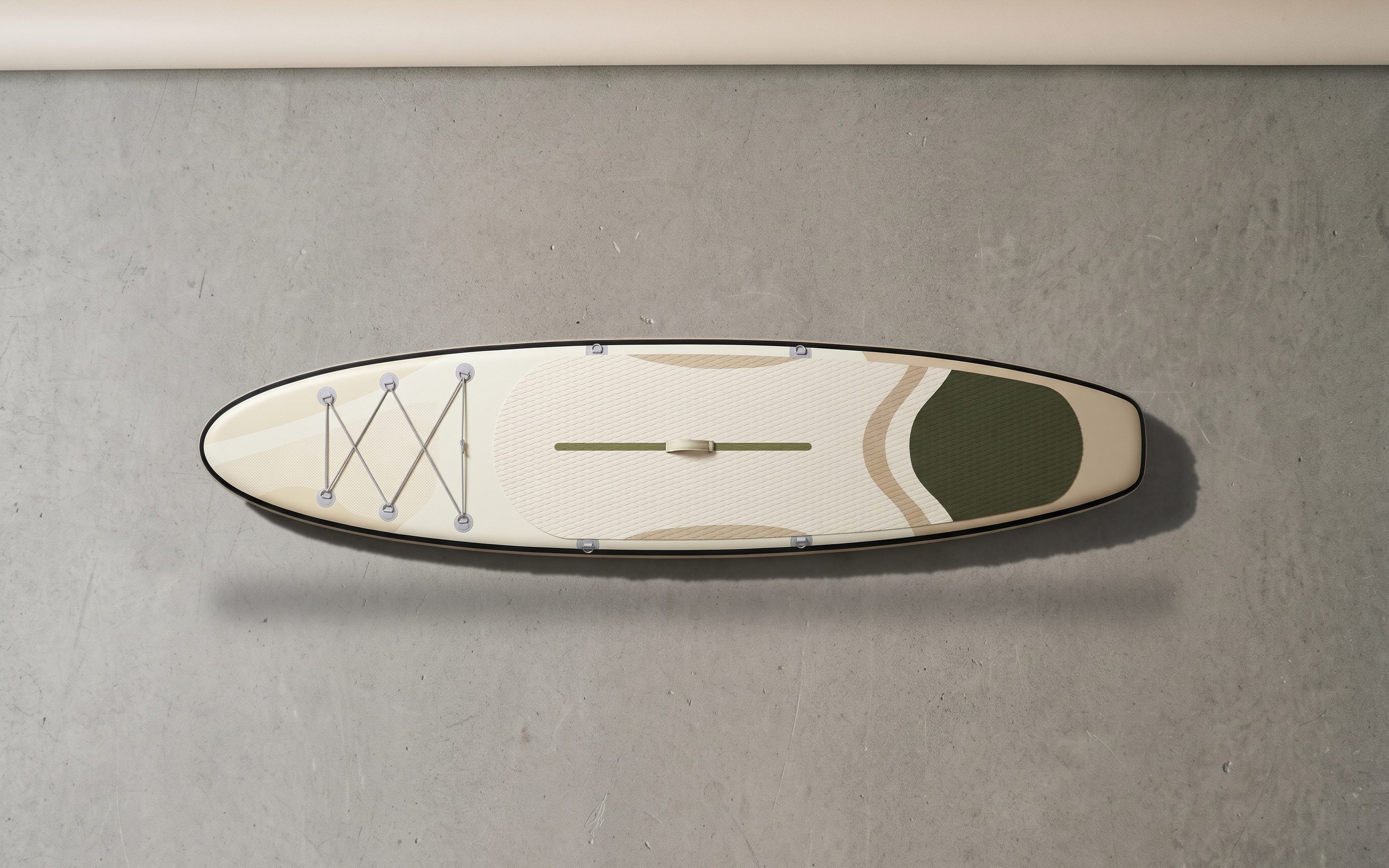 Touring inflatable paddle board, deck side up on a plain floor.