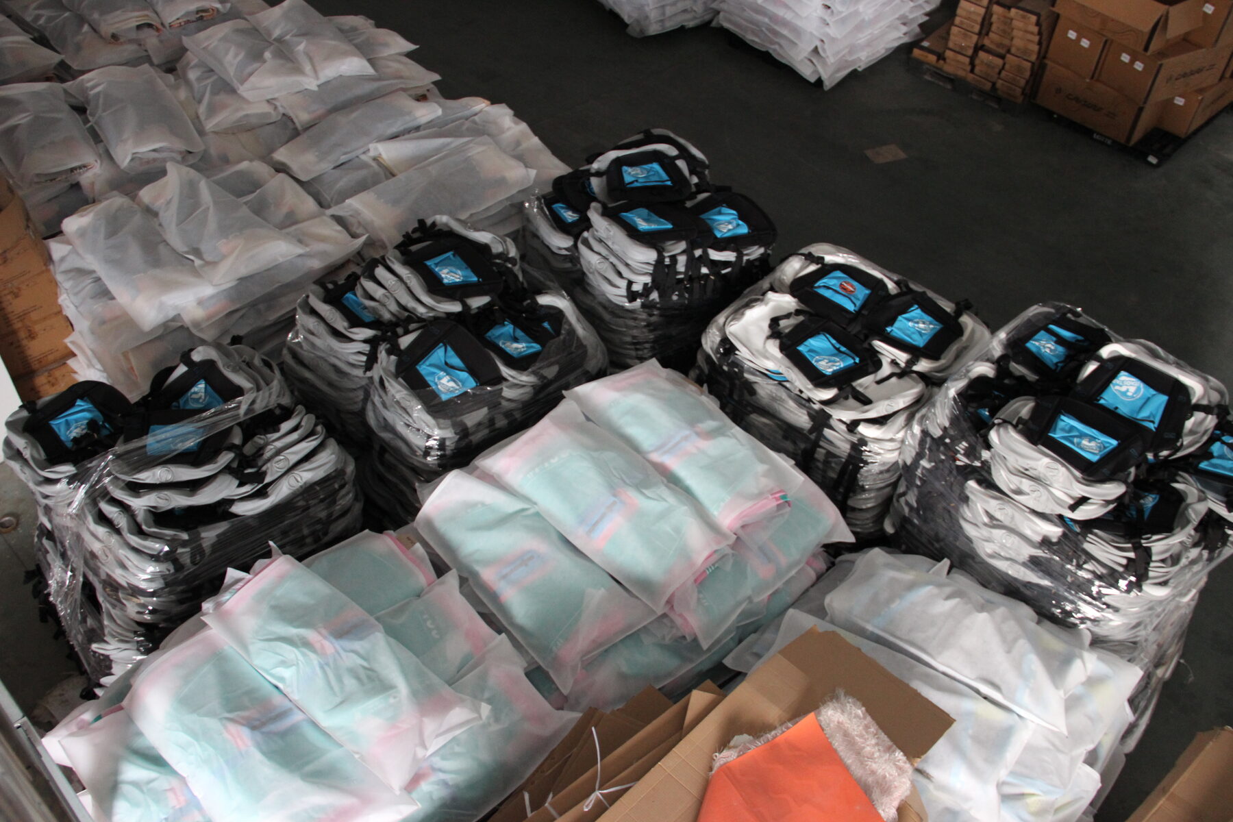 Wrapped finished boards and packed accessory cartons ready for despatch.